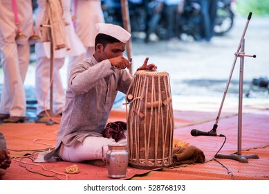 A Man Preparing Pakhavaj One Of The Indian Music Instrument For Kirtan In Rural Village Salunkwadi, Ambajogai, Beed, Maharashtra, India, South East Asia.