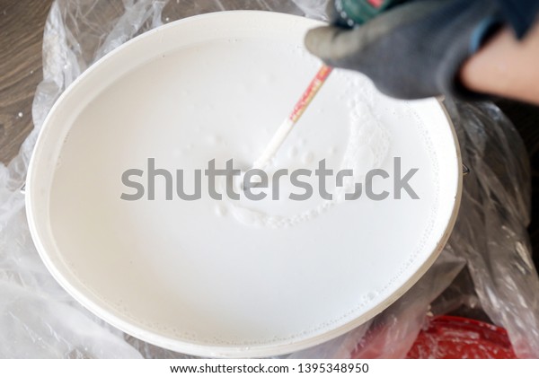 Man Preparing White Paint Interior Walls Stock Photo Edit