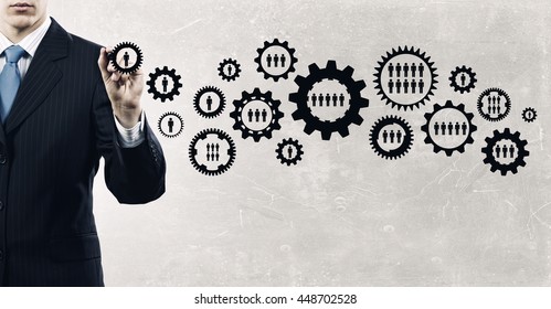 Man presenting teamwork concept . Mixed media