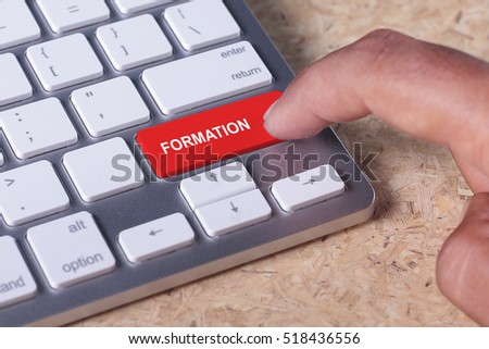 Man pressed keyboard button with FORMATION word