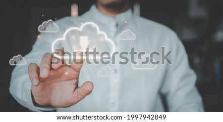Man presses download button  cloud.Cloud computing is system for sharing download and upload big data information.