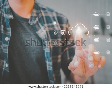 Man presses download button cloud.Cloud computing is system for sharing download and upload big data information. business network connected to Internet server services for cloud transfer.