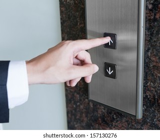 Man Pressing Elevator Button