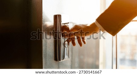 Man pressing elevator button. finger presses the elevator button. Red button. sunset light.