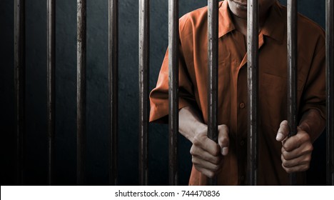 Man in prison - Shutterstock ID 744470836