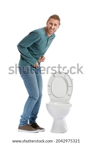 Man with problem of frequent urination on white background. Diabetes symptoms