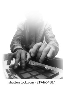 Man Produce Electronic Music In Project Studio. Silhouette. Black And White Photo. Hip Hop Composer. Beatmaker Creates Beats On A Digital Production Controller With Push Button Pads.