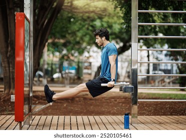 Man, profile and exercise in park for fitness, arm muscle development and training with music. Athlete, equipment and tricep dip at outdoor gym for growth, healthy body and intense challenge in Italy