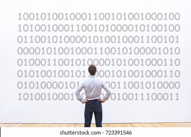man programmer looking at binary code, coding concept, data encryption