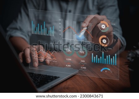 Man programmer using laptop analyzing marketing and development information and Data Management System virtual interface screen.Business Intelligence data analysis, management concept.