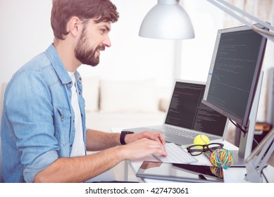 Man programming on his computer