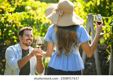 Man proposes to a woman in a vineyard on a sunny day, surrounded by grapevines, creating a romantic setting - Powered by Shutterstock