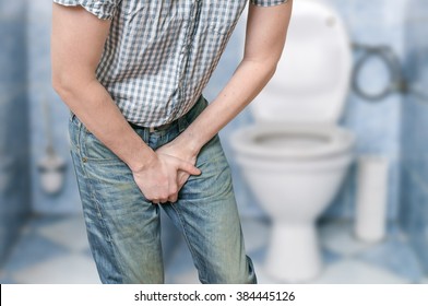 Man With Prostate Problem In Front Of Toilet Bowl. Incontinence 