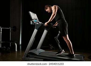 A man with a prosthetic leg works out on a treadmill in dark gym - Powered by Shutterstock