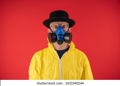 Man In Protective Yellow Suit and Chemical Mask, Glasses and Black Hat. The image of Walter White, Heisenberg. Concept Breaking Bad. Underground Chemist.