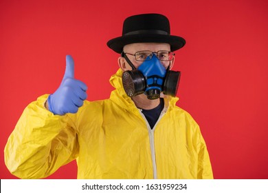 Man In Protective Yellow Suit and Chemical Mask, Glasses and Black Hat shows thumb up. The image of Walter White, Heisenberg. Concept Breaking Bad. Underground Chemist.
