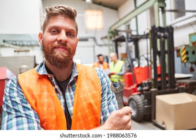 Man As Proud Warehouse Worker With Wrench With Forklift In Background