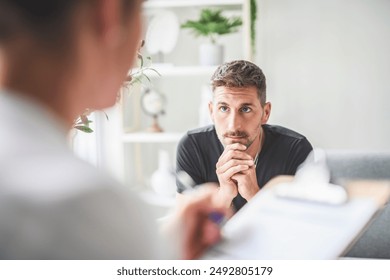 A Man with psychologist theraphy social problems concept drug addiction talk to a psychological woman - Powered by Shutterstock