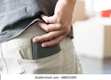 Man Pull Out His Wallet From Back Pocket Pant.