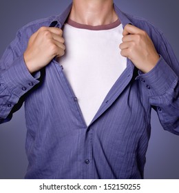 Man Pulling Open Shirt Showing White T Shirt