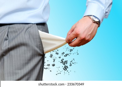Man Pulling out Empty Pocket on blue background
