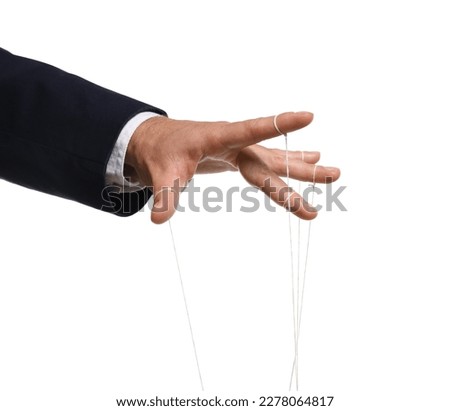 Man pulling strings of puppet on white background, closeup