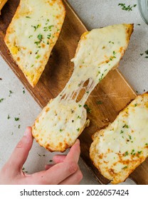 Man Pulls Cheesy Garlic Bread