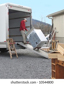 Man Pulls Dryer Onto Moving Van Using A Dolly	