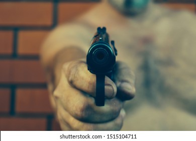 Man Punched The Gun Point Blank. The Hit Man Is Shooting. The Gun In The Hand Of A Bandit. Attempted Murder. Terrorism.