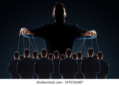 A man, a puppeteer, controls the crowd with threads. The concept of world conspiracy, world government, manipulation, world control