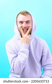 Man Purple Hoodie Showing Gesture Tongue Stock Photo 2205633713 ...