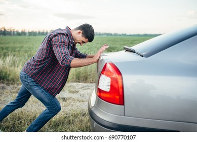 Man Pushing Broken Car, Side View