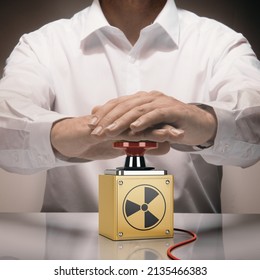 Man pushing a nuke button. Concept of nuclear war. Composite image between a hand photography and a 3D background.