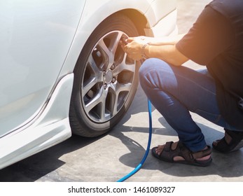 Man Put Air Into The Car Tire Cause Of Low Air Pressure .