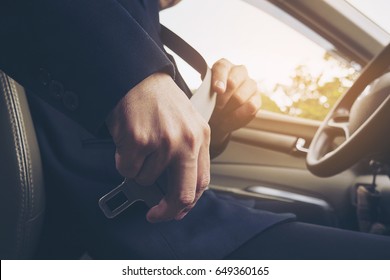 Man Putting Car Seat Belt Before Driving, Close Up At Belt Buckle, Safe Drive Concept