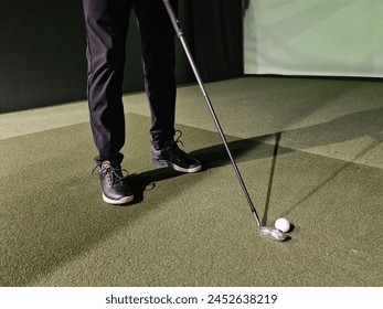 Man Putting Golf Ball on Green - Powered by Shutterstock