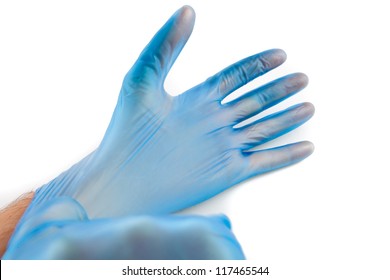 Man Putting On Blue Disposable Rubber Gloves