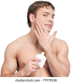 Man Putting On Cream Lotion For Face