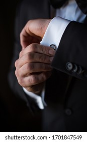 Man Putting On Custom Circle Cuff Links