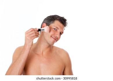 Man Putting On Make Up And Powdering His Face