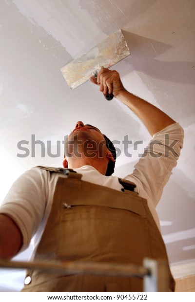 Man Putting Plasterboard Ceiling Stock Photo Edit Now 90455722