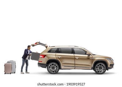 Man putting suitcase in the trunk of a SUV isolated on white background