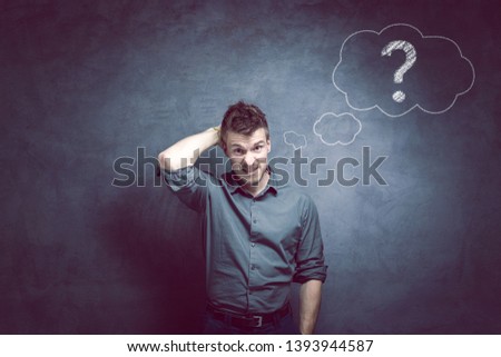 Man with questionmark on the wall. 