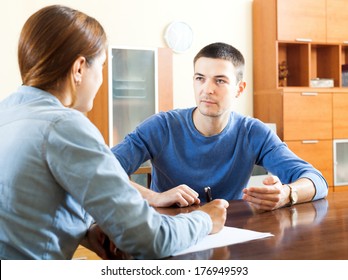 Man  Questionnaire For Social Worker Or Employee At Table At Home