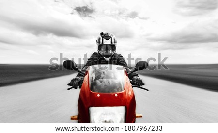 Similar – Senior man steering motorcycle on road