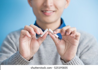 Man Quit Smoking With Blue Background, Asian