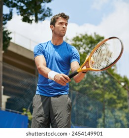 Man, racket and serve in outdoor tennis match, game and court for competition or practice. Male person, athlete and ready for training or exercise, workout and hobby for action and play fitness - Powered by Shutterstock