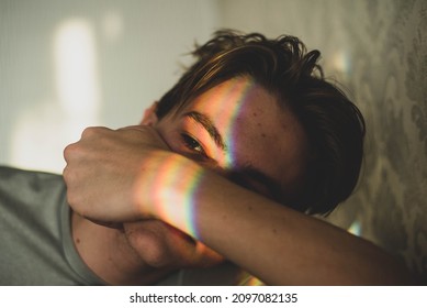 Man With Rainbow On Eyes Shadow And Smiley Nailpaint. LGBT Concept. Teenagers Problems, Sad Boy, Skin Problem.