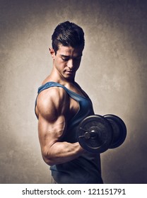 Man Raising A Dumbbell