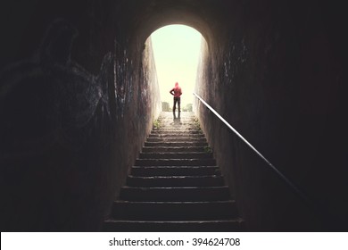 Man Raising Stairs To Reach The City From Dark Alley